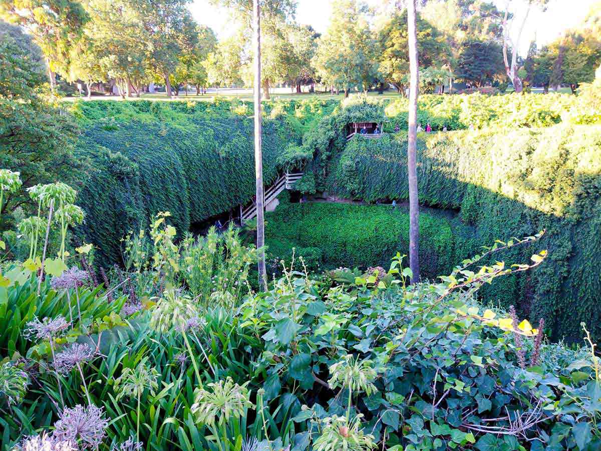 Staircase down to the sunken garden inside the Umpherston Sinkhole. Located in Mount Gambier, Limestone Coast, South Australia.