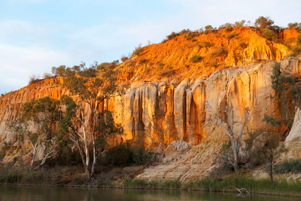 Headings Cliff at sunset while on a guided river cruise with Renmark River Cruises. Renmark, Riverland, South Australia. 