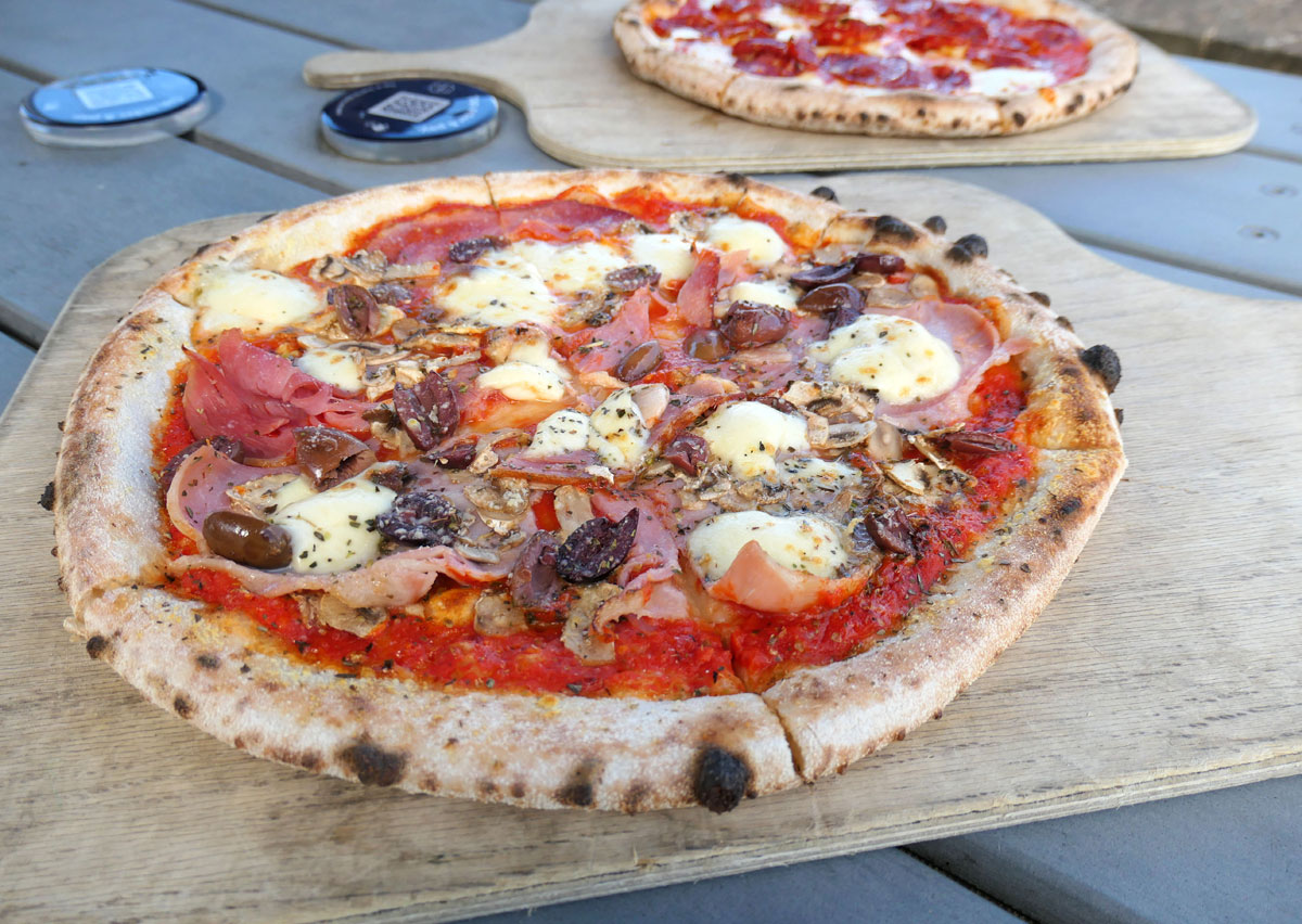 Pizza on the menu, provided by Ember next door