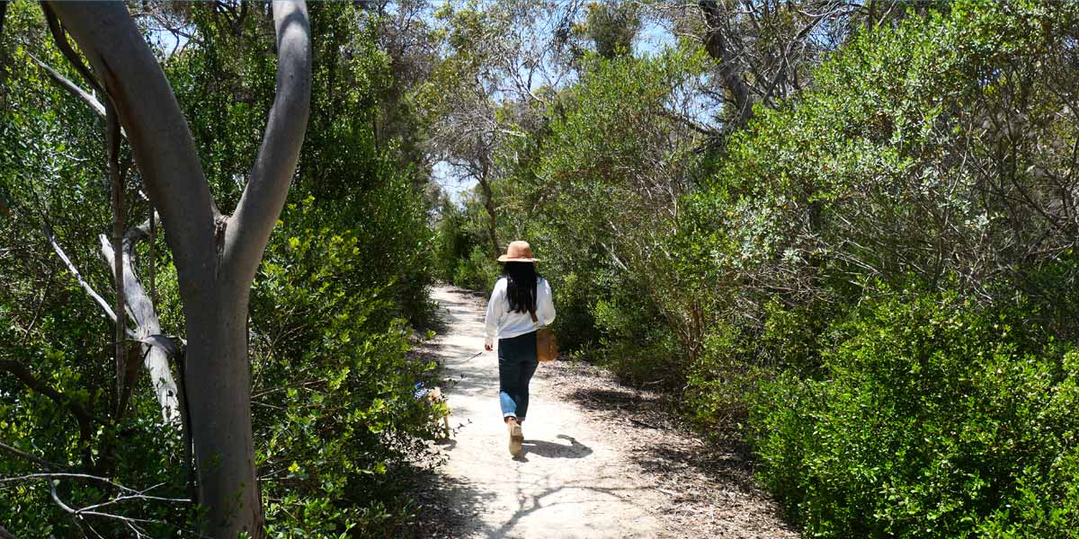 Sheryl walking along Oyster Trail towards Snapper Point. Located in Coffin Bay, Eyre Peninsula, South Australia.