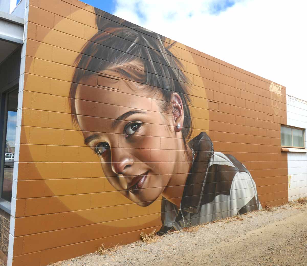 Tumby Bay Street Art 14 - Girl in Striped Polo by Smug. Located in Tumby Bay, Eyre Peninsula, South Australia.