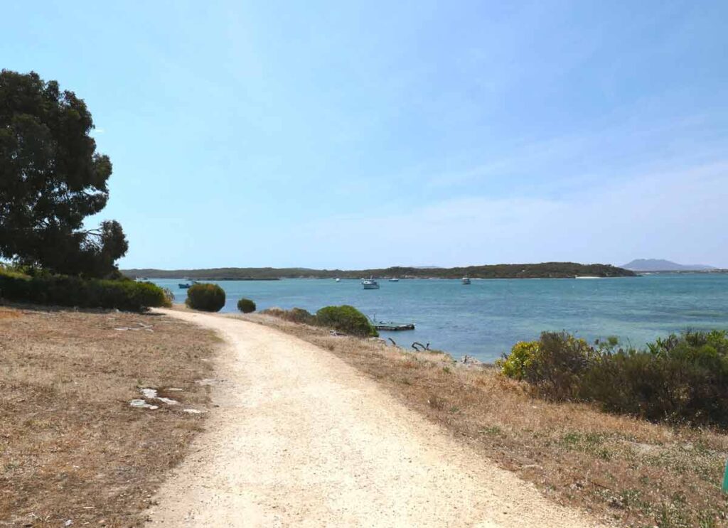 Flat gravel Oyster Walk Trail heading westward. Located in Coffin Bay, Eyre Peninsula, South Australia.