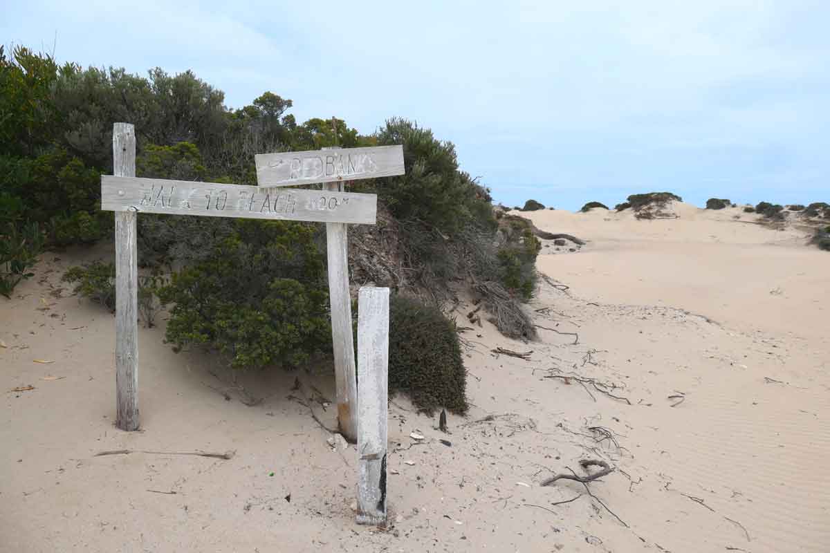 Faded sign for the beach at Red Banks. Located in Whaler's Way Sanctuary, Eyre Peninsula, South Australia.