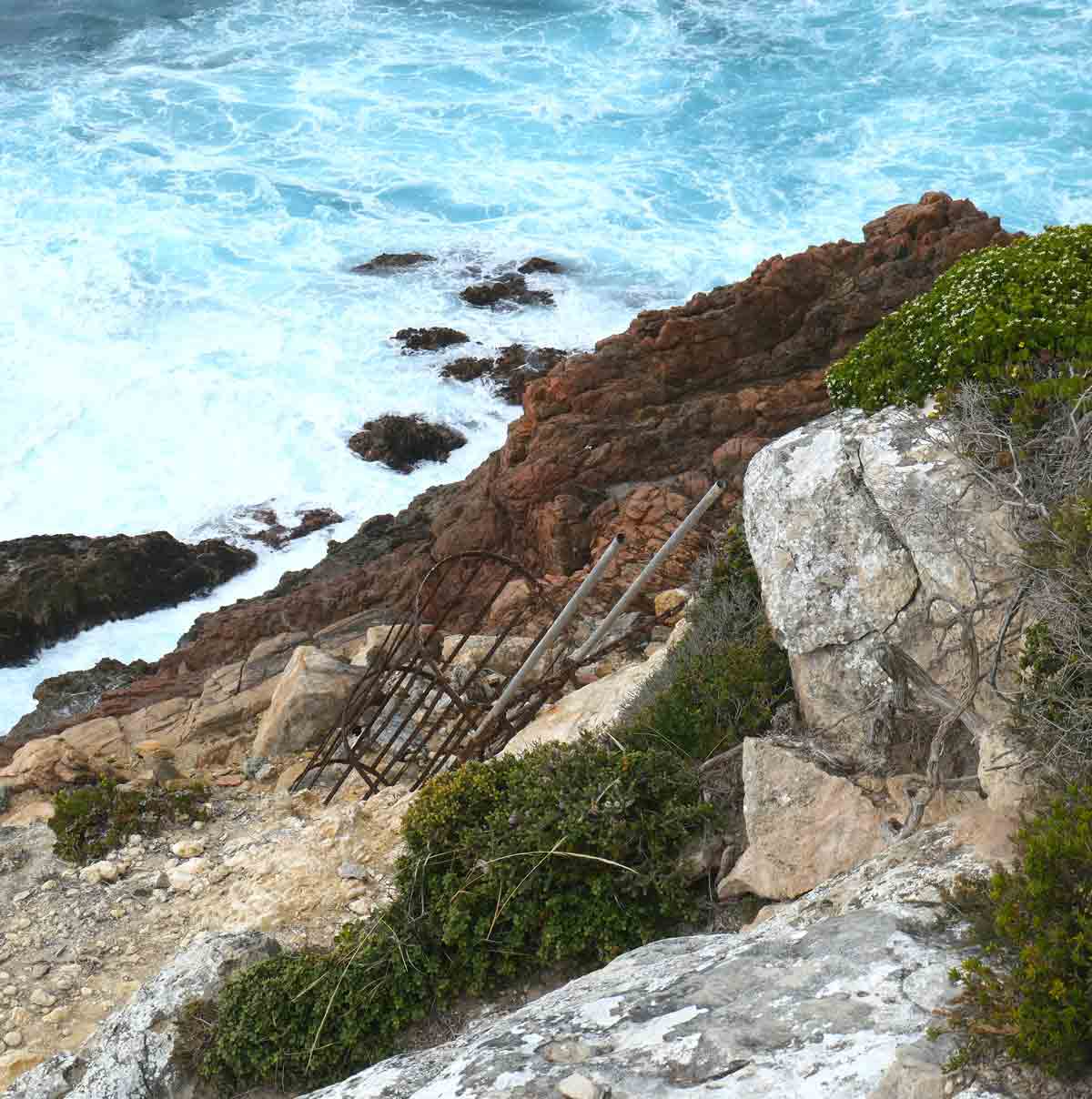 The rusty rickety-looking ladder at the Swimming Hole. Located in Whaler's Way Sanctuary, Eyre Peninsula, South Australia.